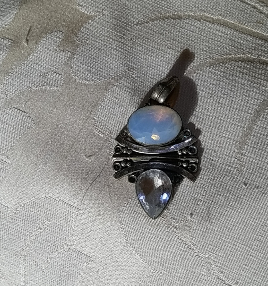 Pendant with crystal and moonstone cabochons.